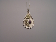 Silver & 18ct gold pendant with deep red Sapphire